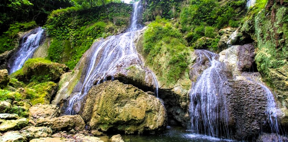 Dramatic shots of White Surf Waterfall and Whispering Palms Beach on Little Andaman Island.